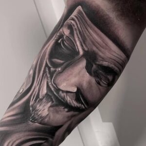 Realistisk tatovering. Anonymous maske