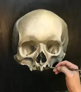 Hyperrealistisk maleri af kranium under arbejde. Hånd maler med pensel fra Tattoo Mini