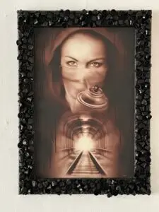 Airbrush Portrait of a masked woman holding a spray can, with a glowing train tunnel in the background.from Tattoo Mini